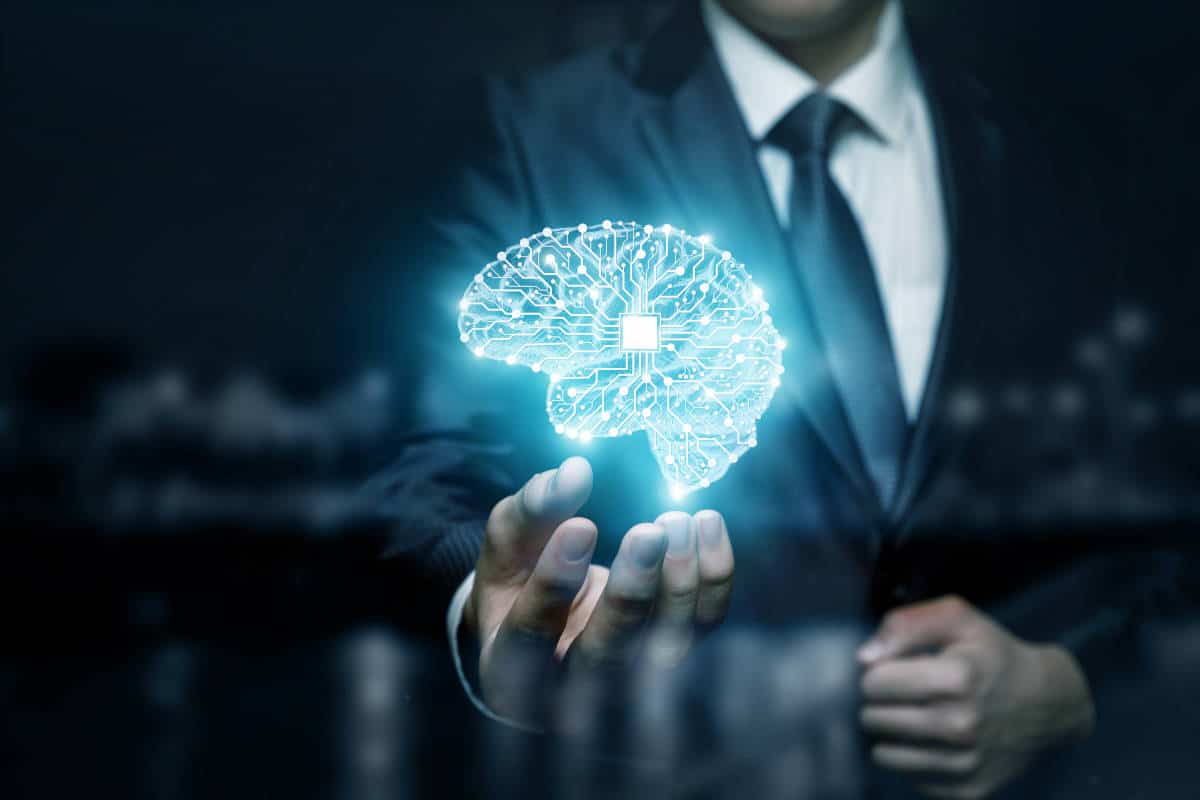 A businessman is showing a luminant brain